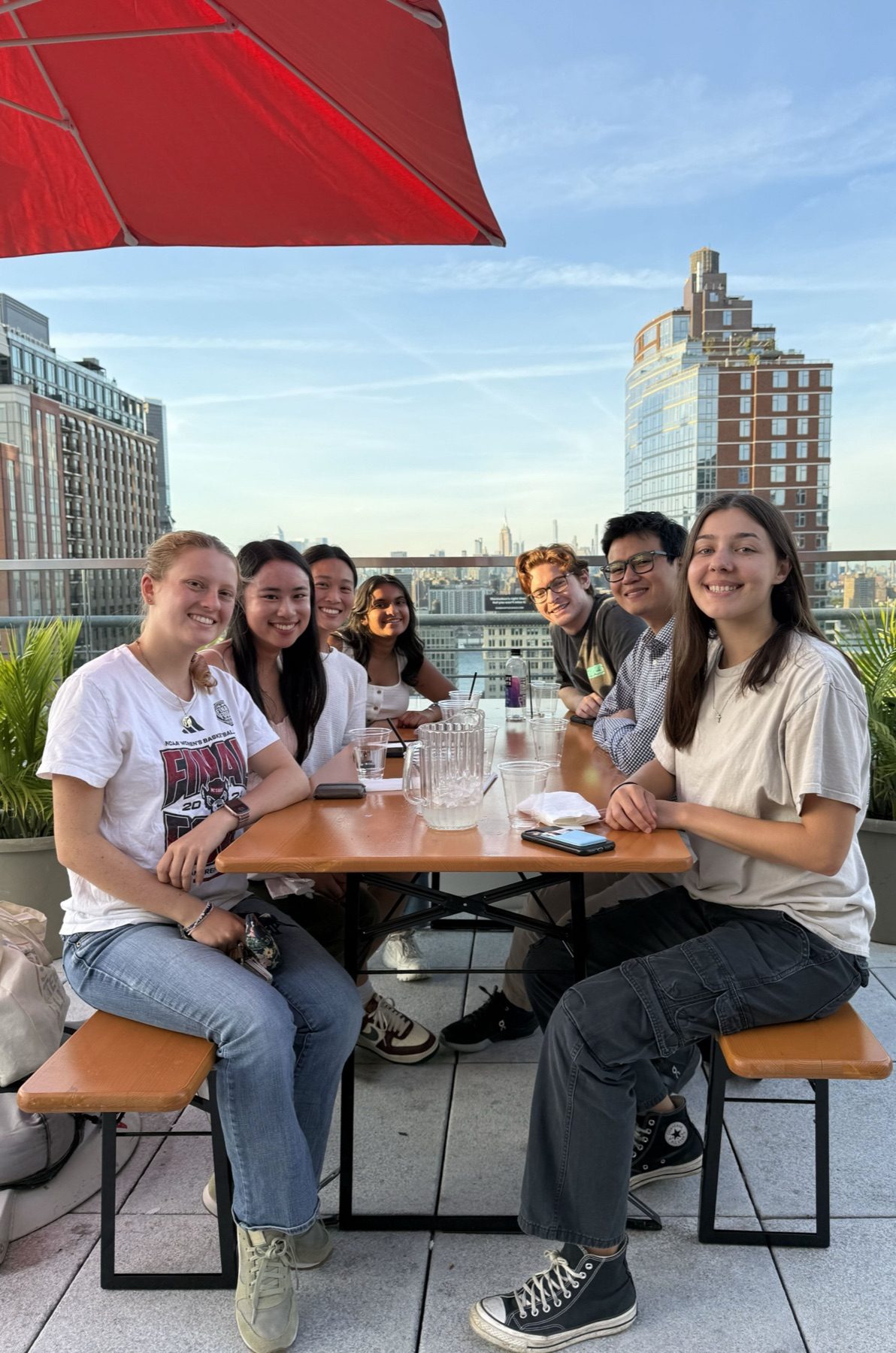 Lab hanging out on a Brooklyn rooftop with the Manhattan skyline behind